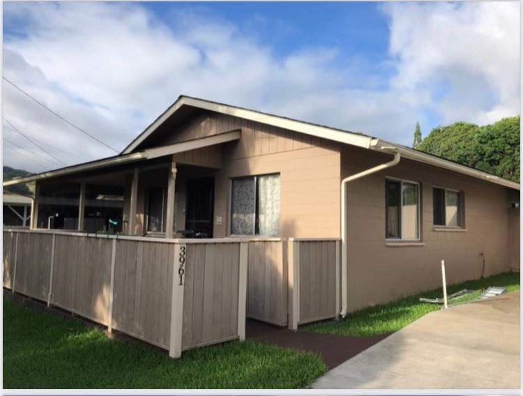 3961 Koloa Road Koloa, HI 96756 - Photo 1 of 1 a view of a house with wooden walls and a yard