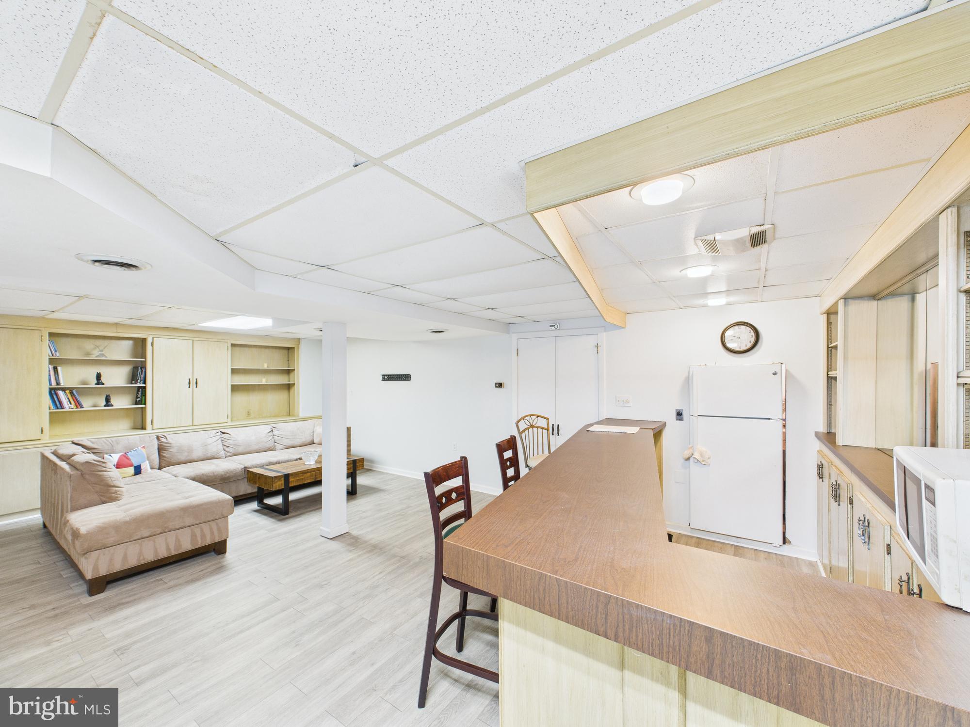 14212 Notley Road Silver Spring, MD 20904 - Photo 28 of 43 a living room with furniture and a large window