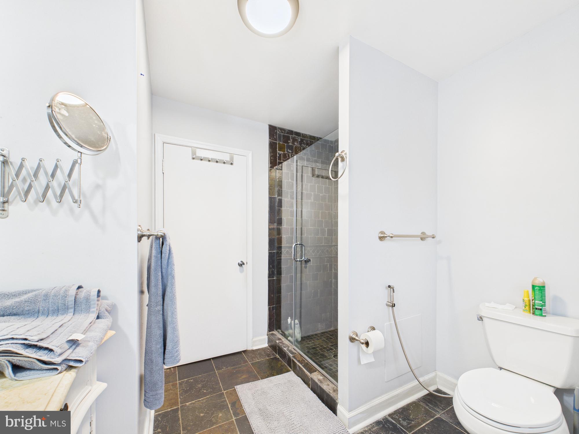 14212 Notley Road Silver Spring, MD 20904 - Photo 39 of 43 a bathroom with a toilet and a shower