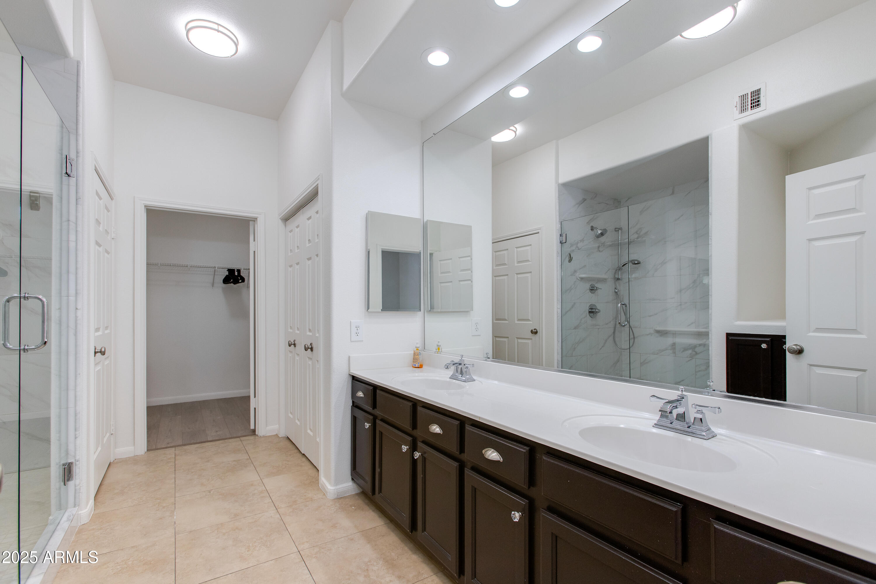 8245 East Bell Road, Unit 102 Scottsdale, AZ 85260 - Photo 11 of 21 a spacious bathroom with a double vanity sink mirror and double