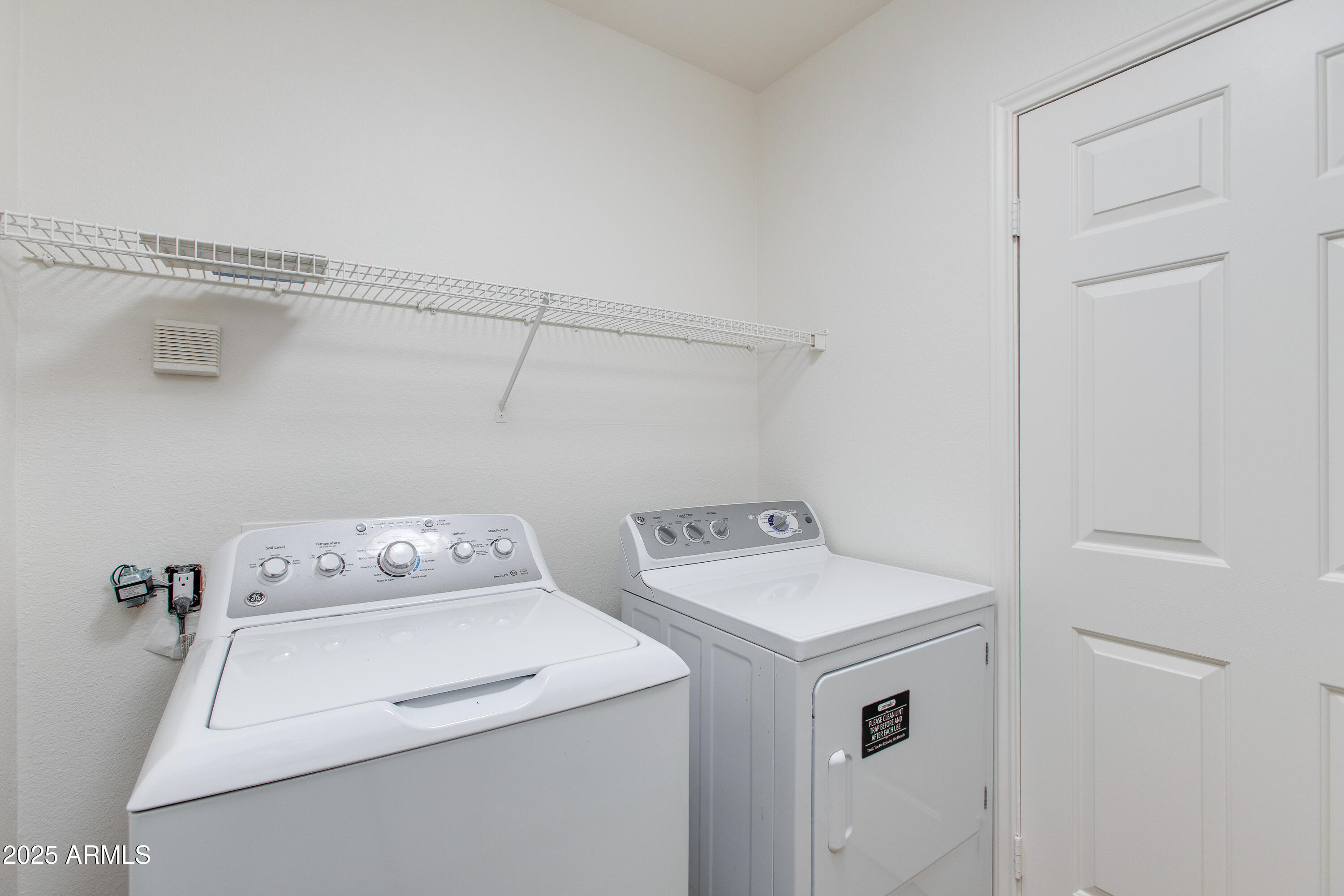 8245 East Bell Road, Unit 102 Scottsdale, AZ 85260 - Photo 17 of 21 a utility room with dryer and washer