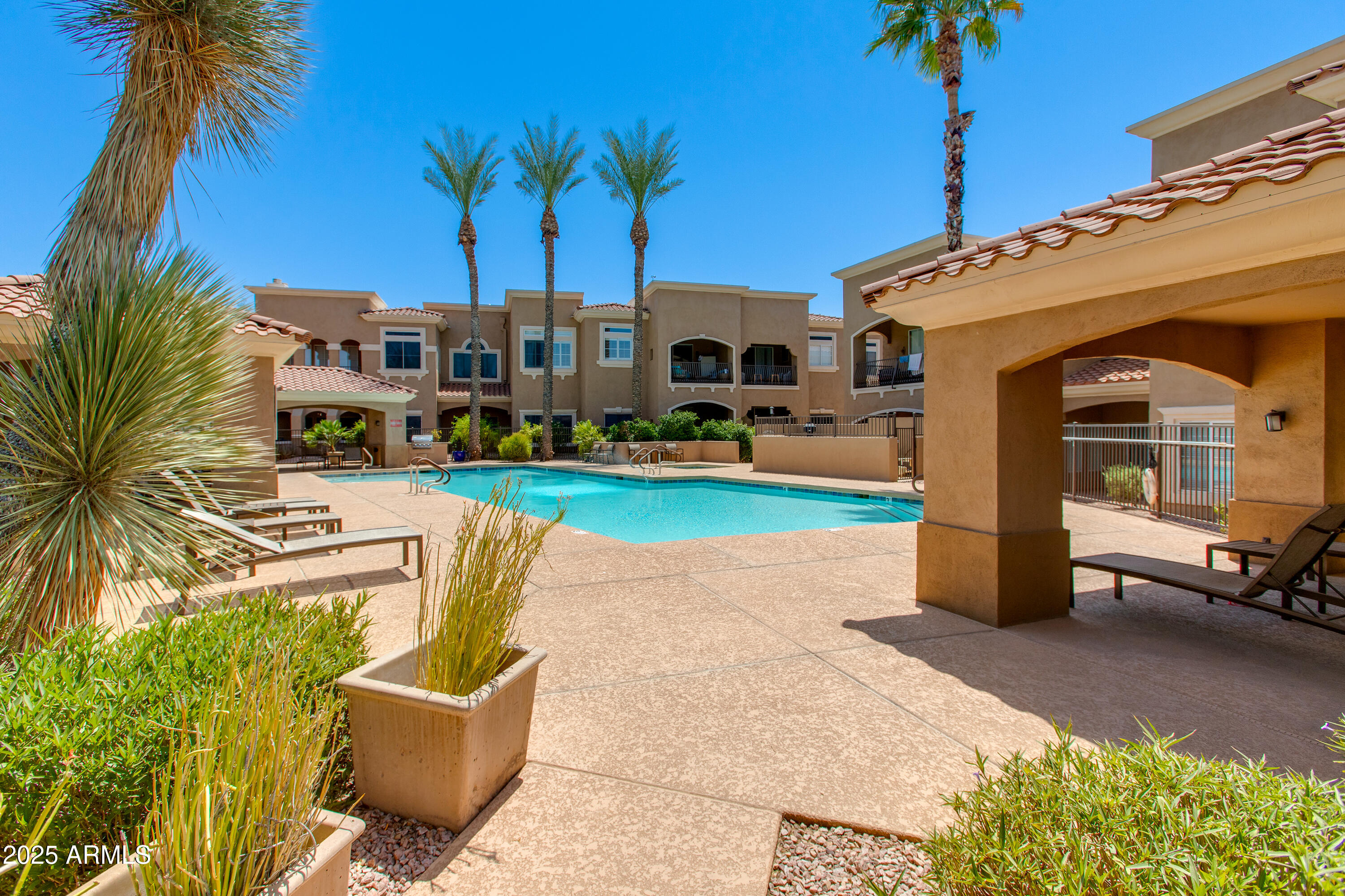 8245 East Bell Road, Unit 102 Scottsdale, AZ 85260 - Photo 19 of 21 a house view with a garden space