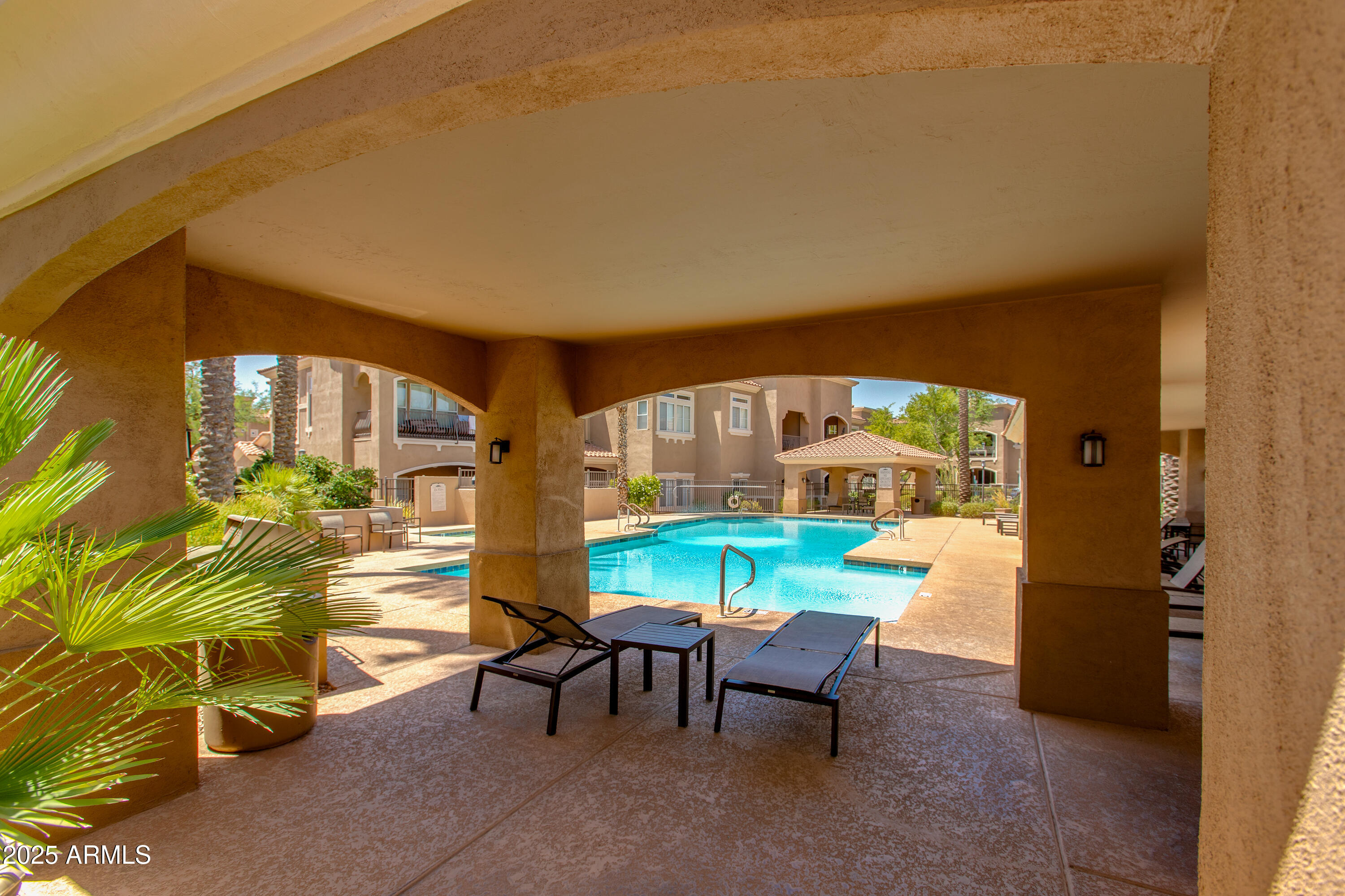8245 East Bell Road, Unit 102 Scottsdale, AZ 85260 - Photo 20 of 21 a view of an chairs and table in the balcony