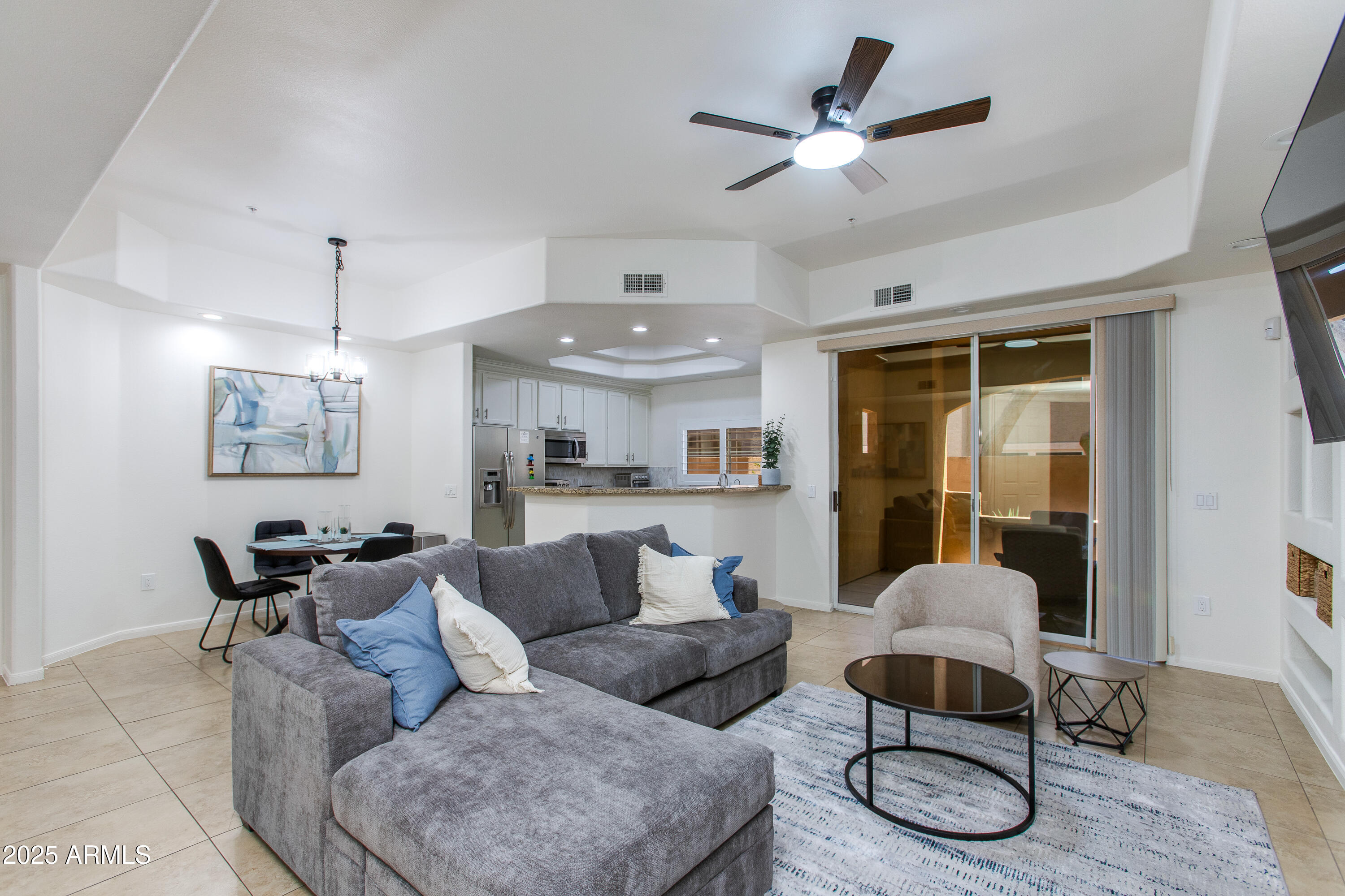 8245 East Bell Road, Unit 102 Scottsdale, AZ 85260 - Photo 3 of 21 a living room with furniture