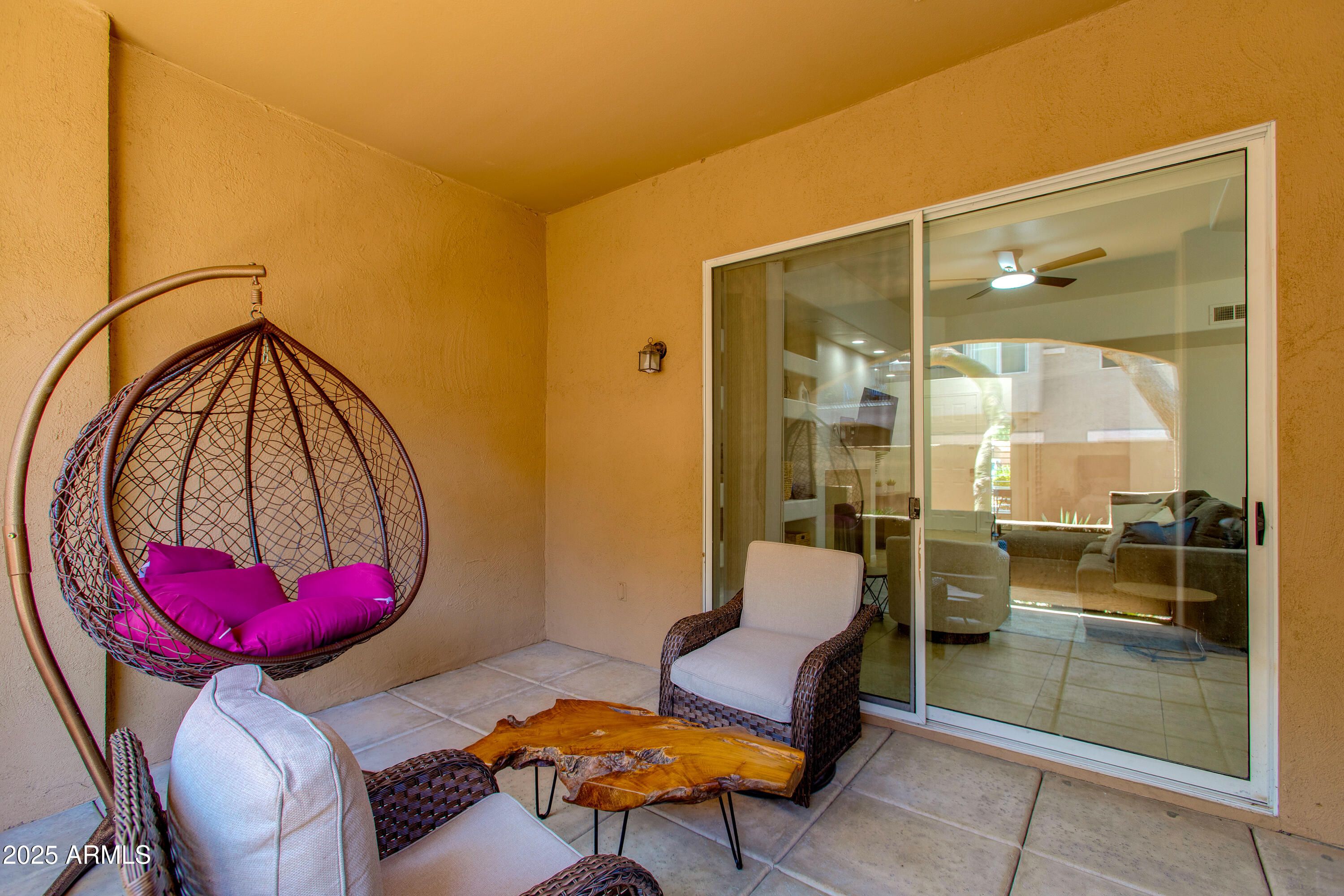 8245 East Bell Road, Unit 102 Scottsdale, AZ 85260 - Photo 6 of 21 a living room with furniture