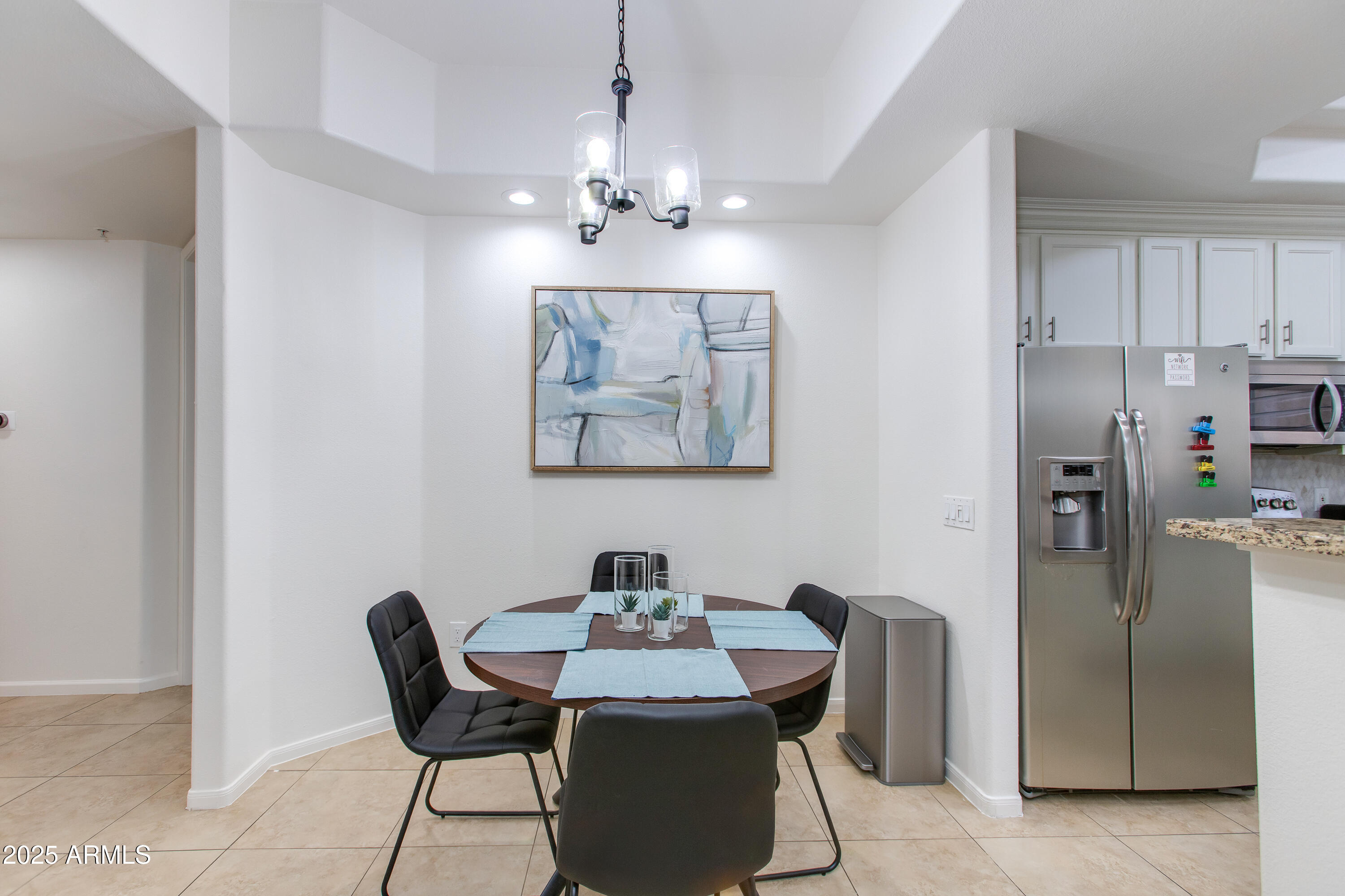 8245 East Bell Road, Unit 102 Scottsdale, AZ 85260 - Photo 7 of 21 a view of a dining room with furniture