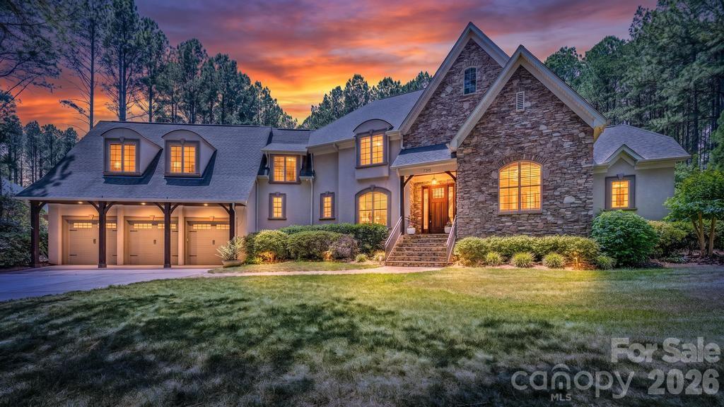 7315 Bay Ridge Drive Denver, NC 28037 - Photo 1 of 39 a front view of a house with a yard