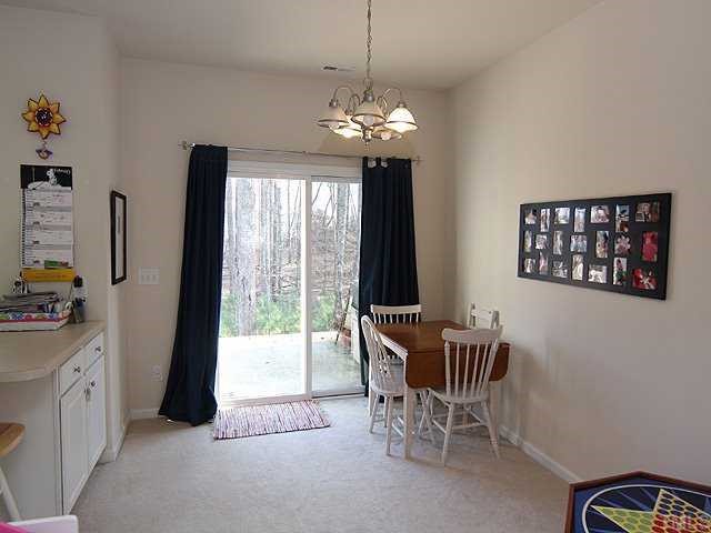 8137 Rhiannon Road Raleigh, NC 27613 - Photo 5 of 9 a dining room with furniture and window