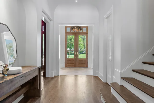 a kitchen with stainless steel appliances a stove and a microwave