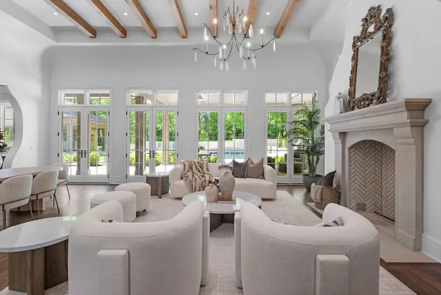 a living room with furniture a lamp and a fireplace