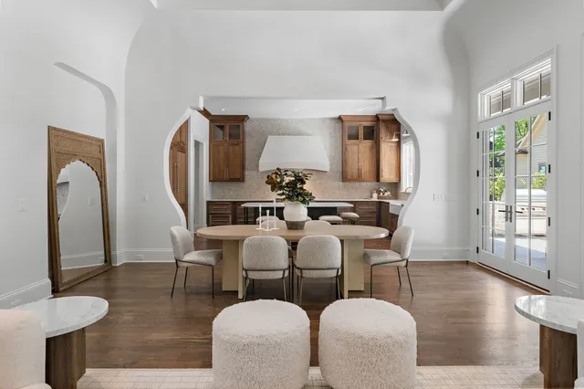 a bathroom with a granite countertop sink a mirror and a shower