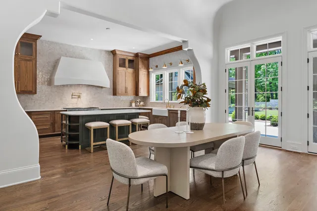 a white bath tub sitting in a bathroom next to a window