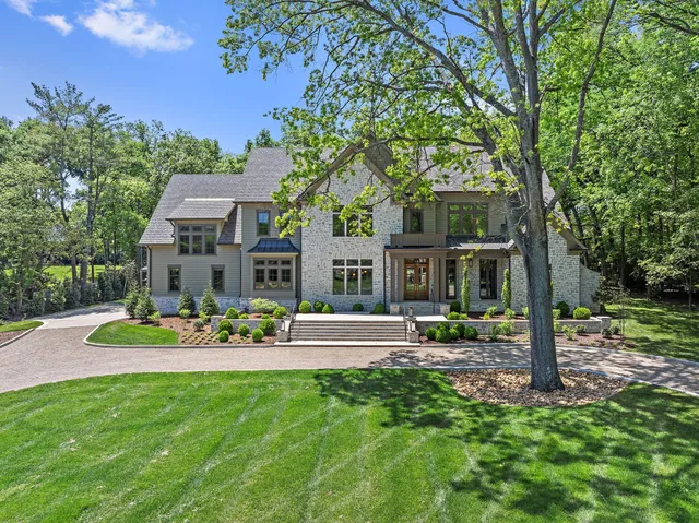 a front view of a house with a yard table and chairs
