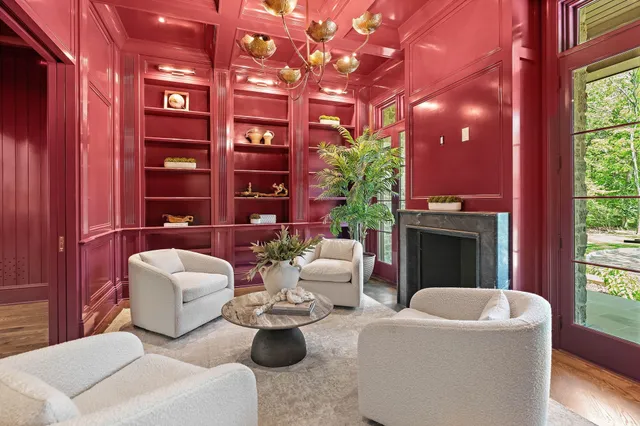 a view of an empty room with wooden floor and closet
