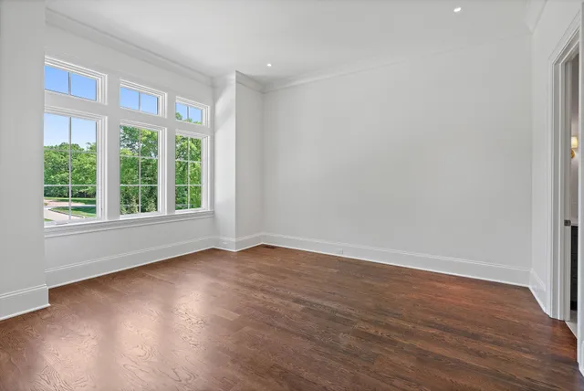 a front view of a house with a yard table and chairs