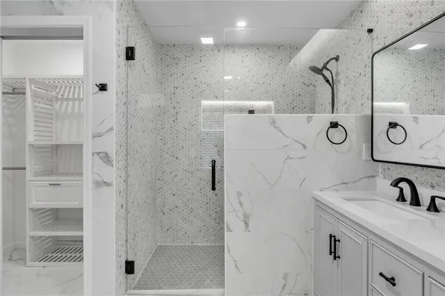 a view of a room with a window and a ceiling fan