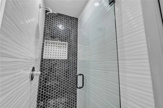 a view of room with window and ceiling fan