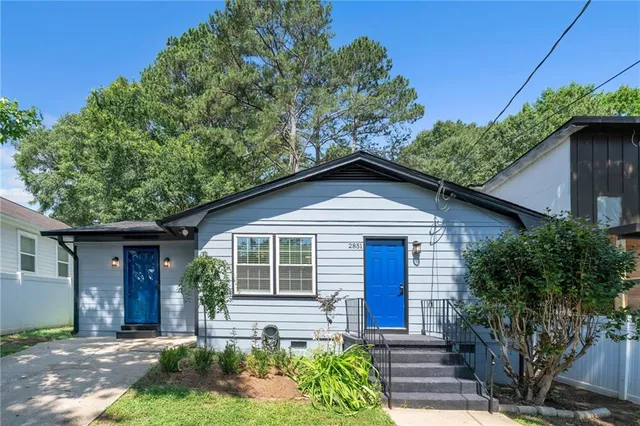 a front view of a house with garden