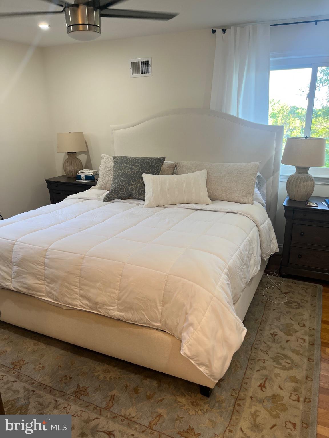 304 Old Courthouse Road Northeast Vienna, VA 22180 - Photo 22 of 25 Serene bedroom with natural light.