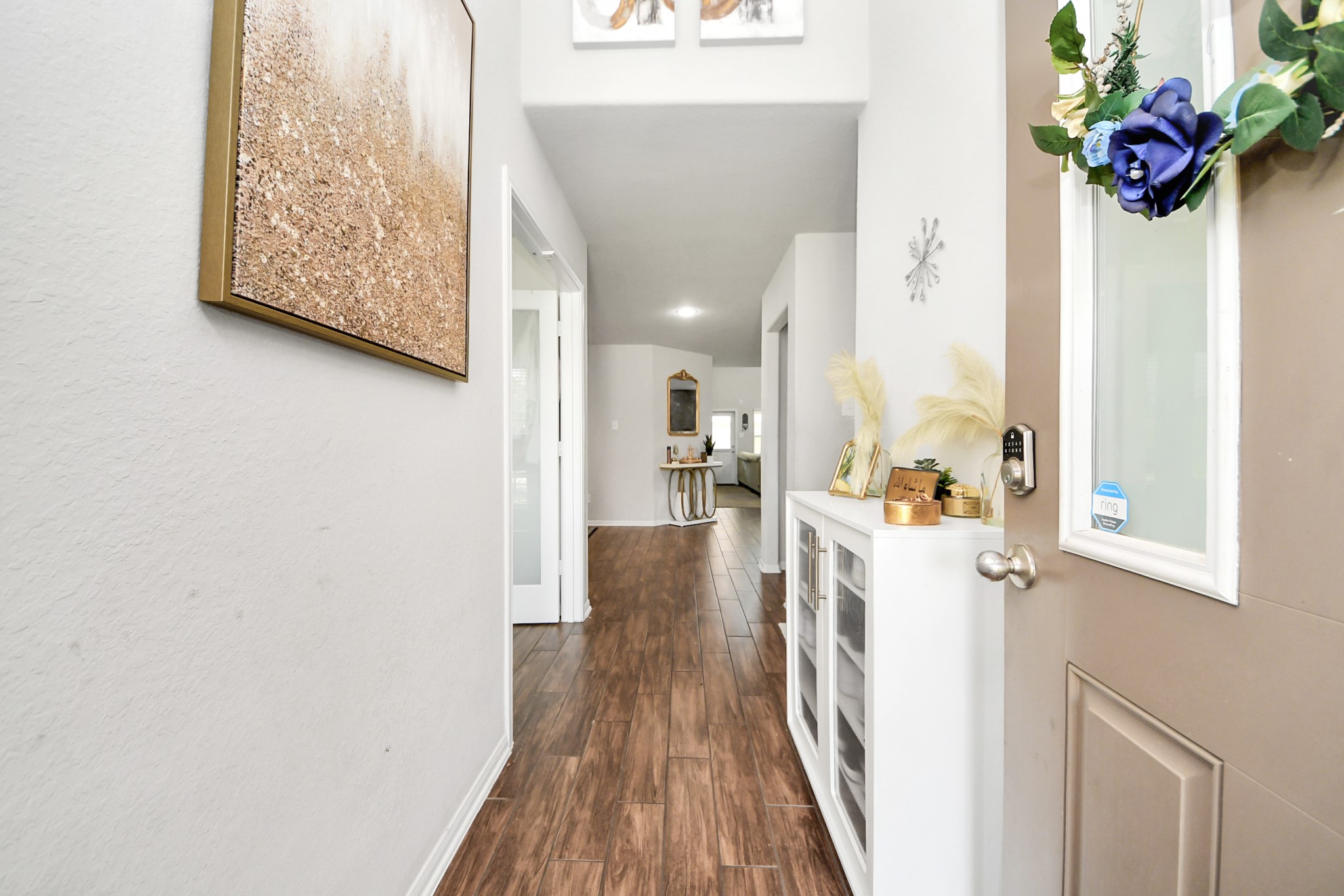 2643 Ridgeback Drive Rosenberg, TX 77471 - Photo 5 of 46 a view of a hallway with wooden floor and staircase