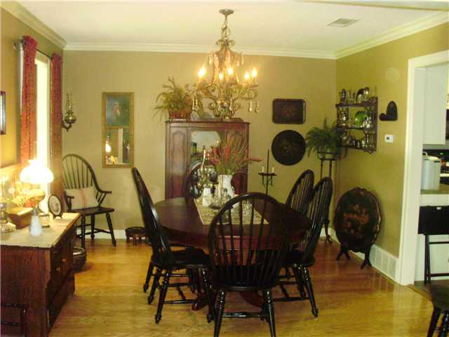 730 Stewart Road Eads, TN 38028 - Photo 12 of 12 Large Formal Dining Room with beautiful Hardwood floors, crown molding and gorgeous custom chandelier. Very open floorplan, opens to greatroom and kitchen.