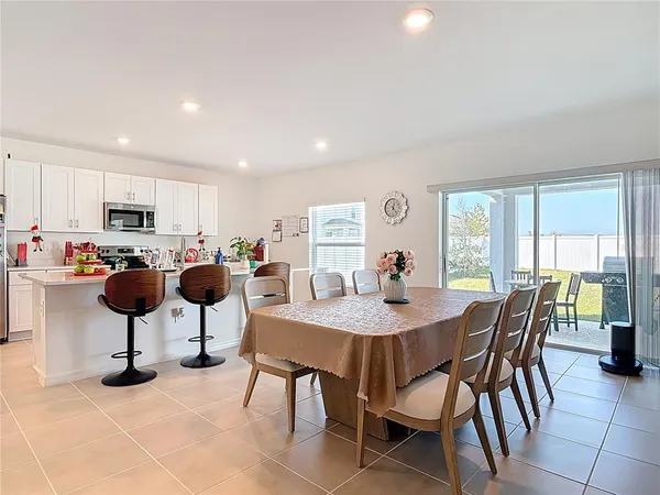 a outdoor dining space with furniture and outdoor view
