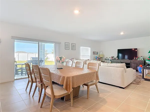 a view of a dining room with furniture and a livingroom