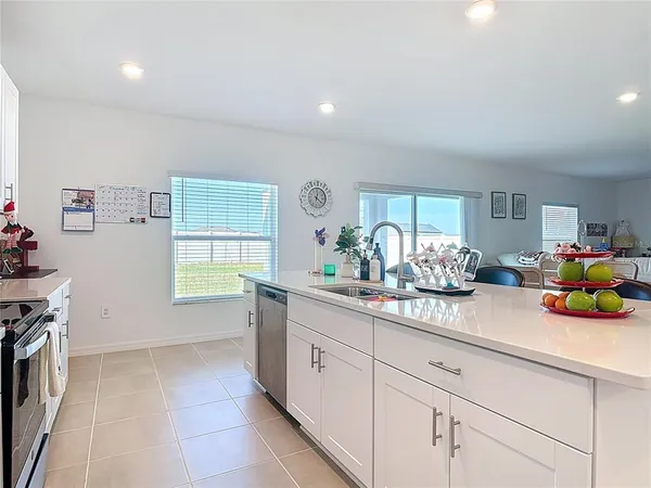a kitchen with sink and cabinets