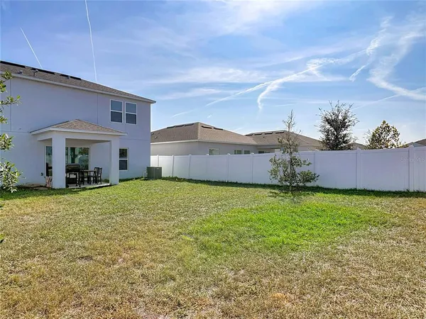 aerial view of a house with a yard