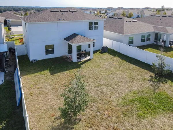 an aerial view of a house with a garden
