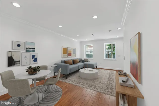 a living room with furniture and a table