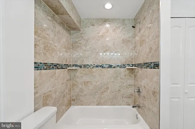 a close view of a bathtub in bathroom