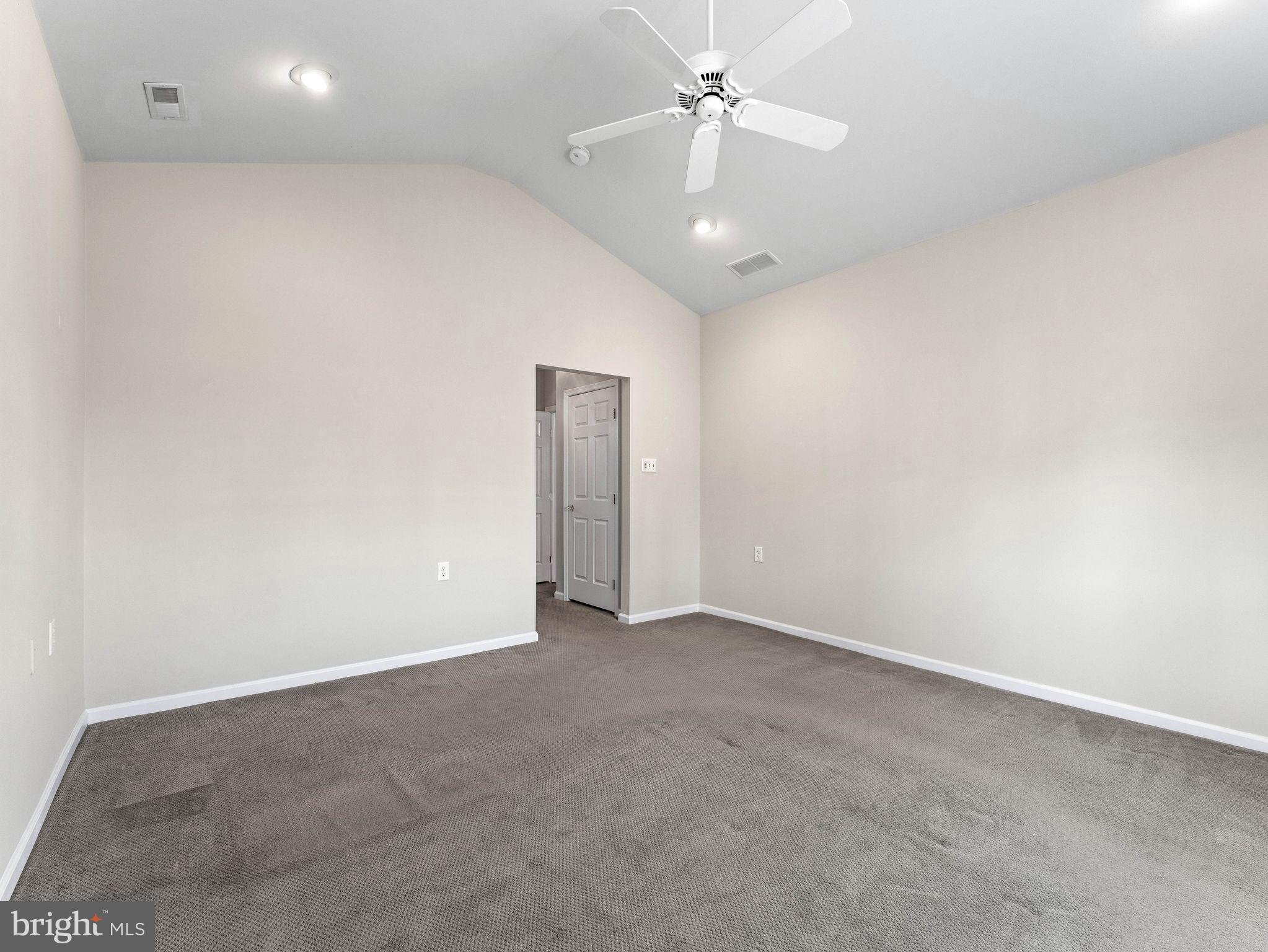 1707 Hulnick Road, Unit 43830 Coatesville, PA 19320 - Photo 25 of 36 an empty room with a ceiling fan and a fan