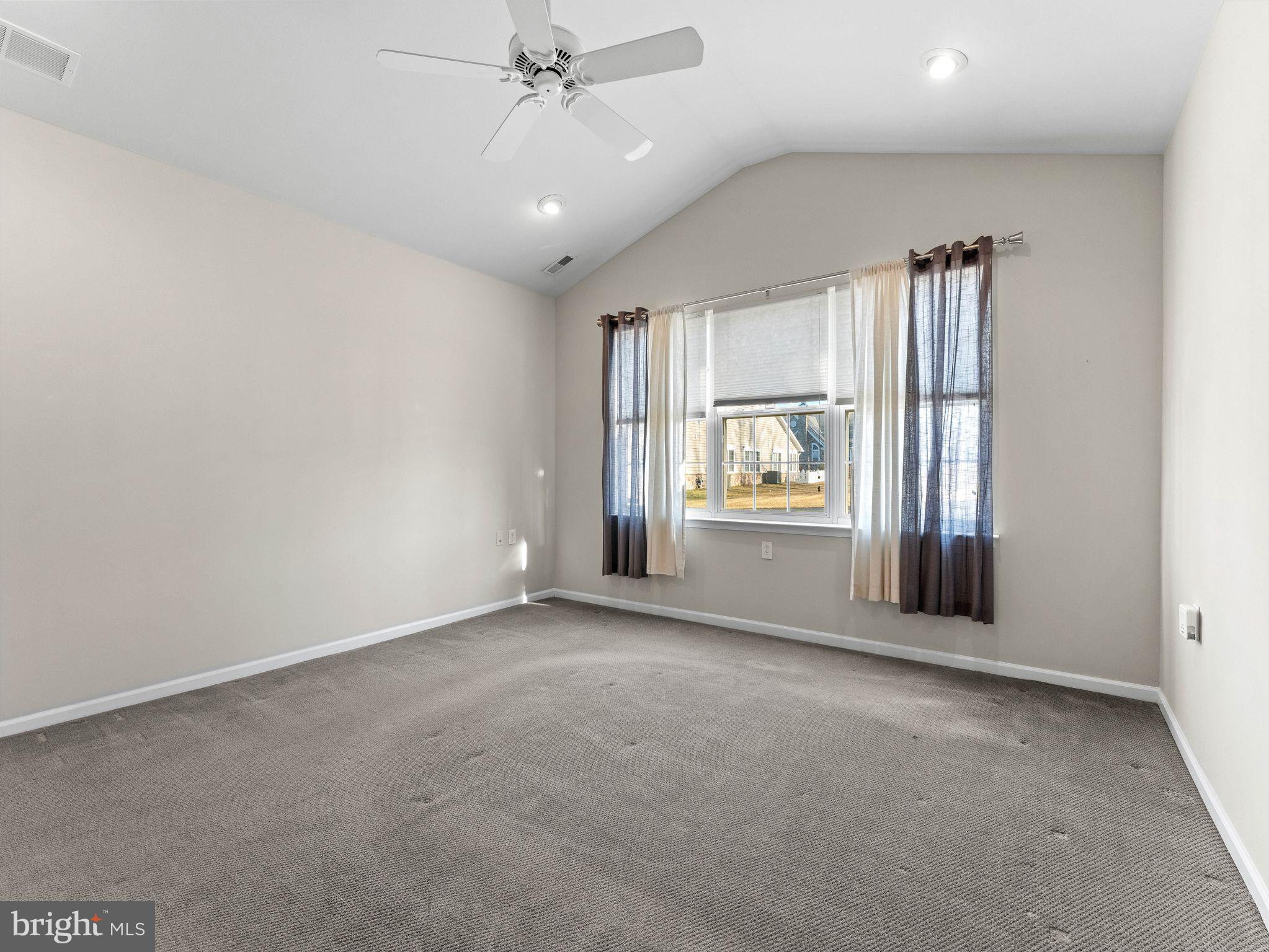 1707 Hulnick Road, Unit 43830 Coatesville, PA 19320 - Photo 26 of 36 an empty room with windows and cabinet