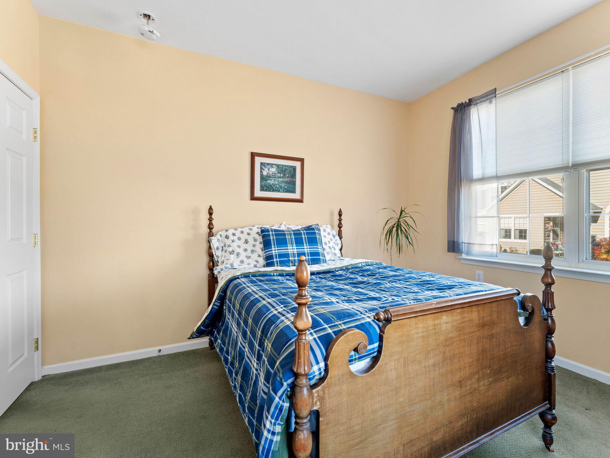 1707 Hulnick Road, Unit 43830 Coatesville, PA 19320 - Photo 31 of 36 a bedroom with bed and window