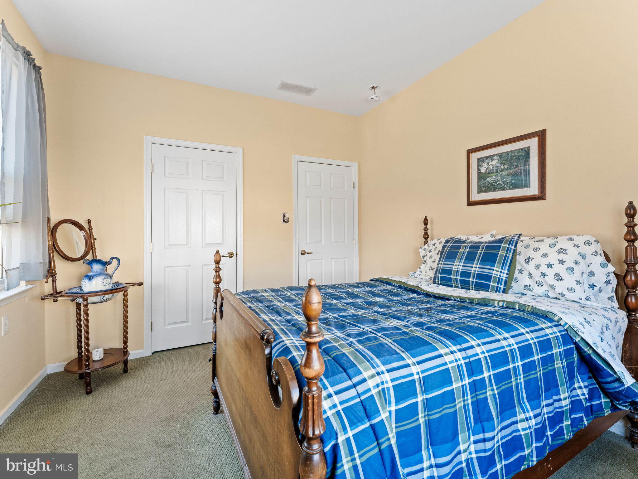 1707 Hulnick Road, Unit 43830 Coatesville, PA 19320 - Photo 32 of 36 a bedroom with a bed and dresser