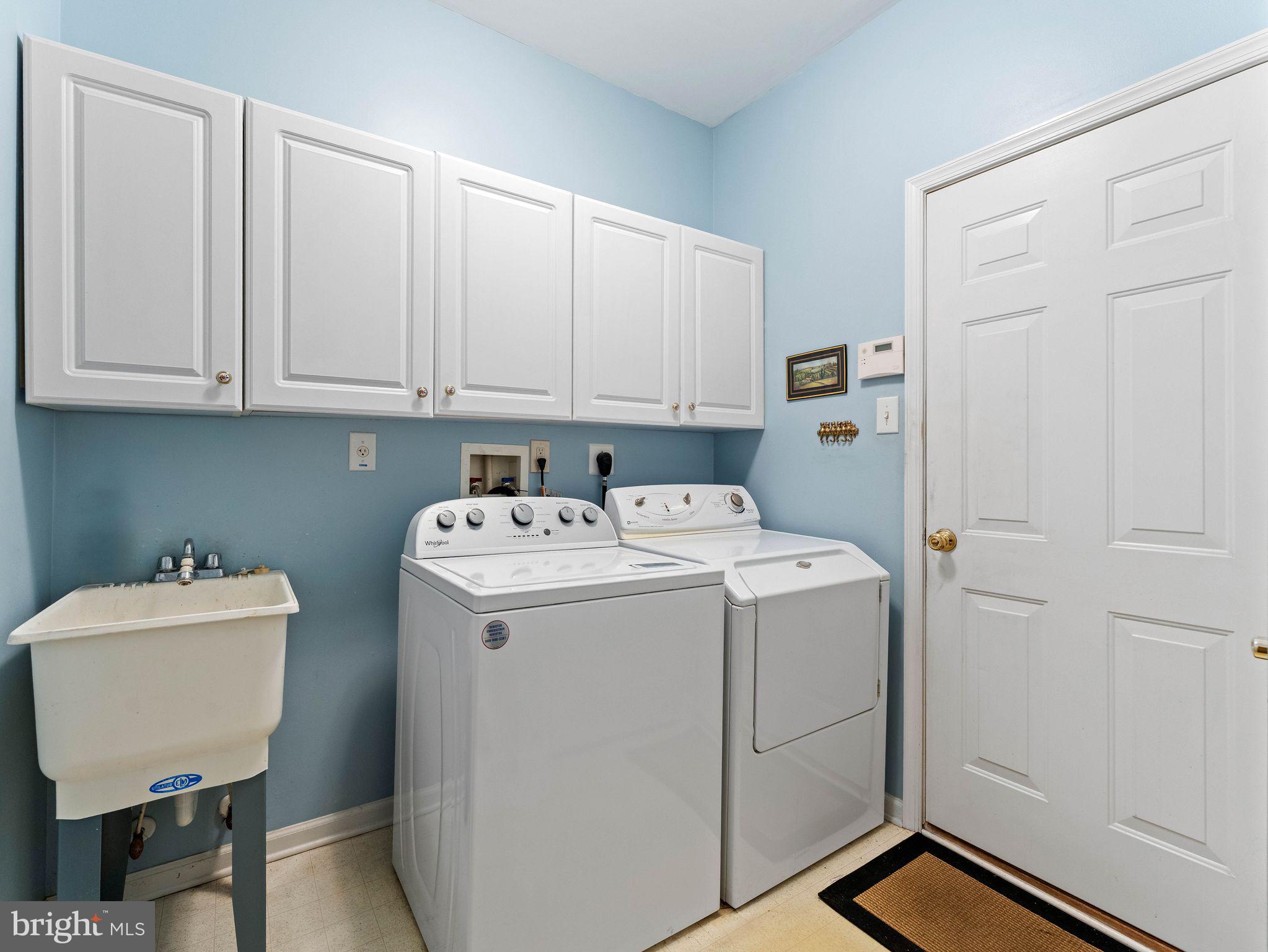 1707 Hulnick Road, Unit 43830 Coatesville, PA 19320 - Photo 33 of 36 a utility room with dryer and washer