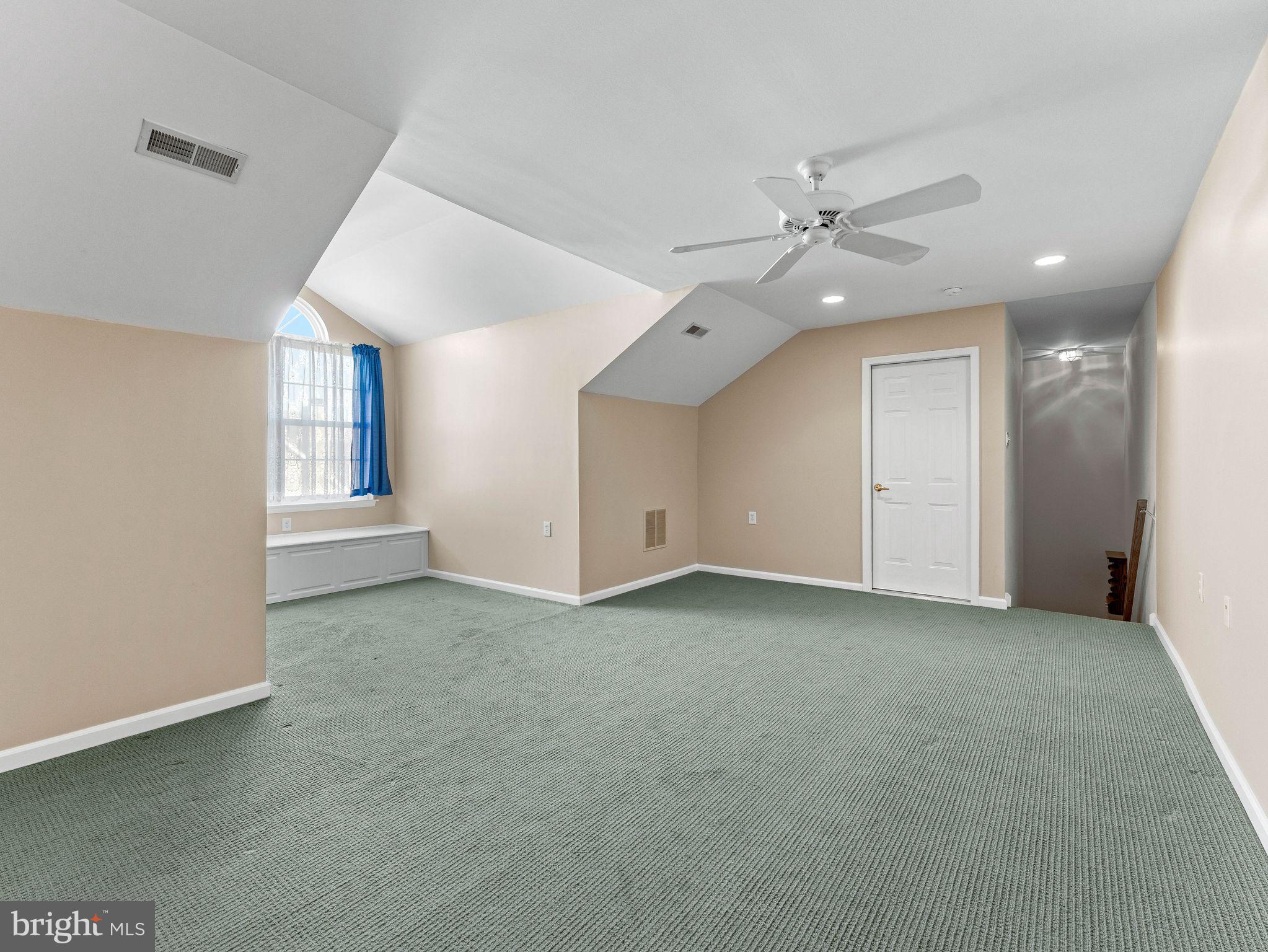 1707 Hulnick Road, Unit 43830 Coatesville, PA 19320 - Photo 36 of 36 an empty room with a ceiling fan and a window