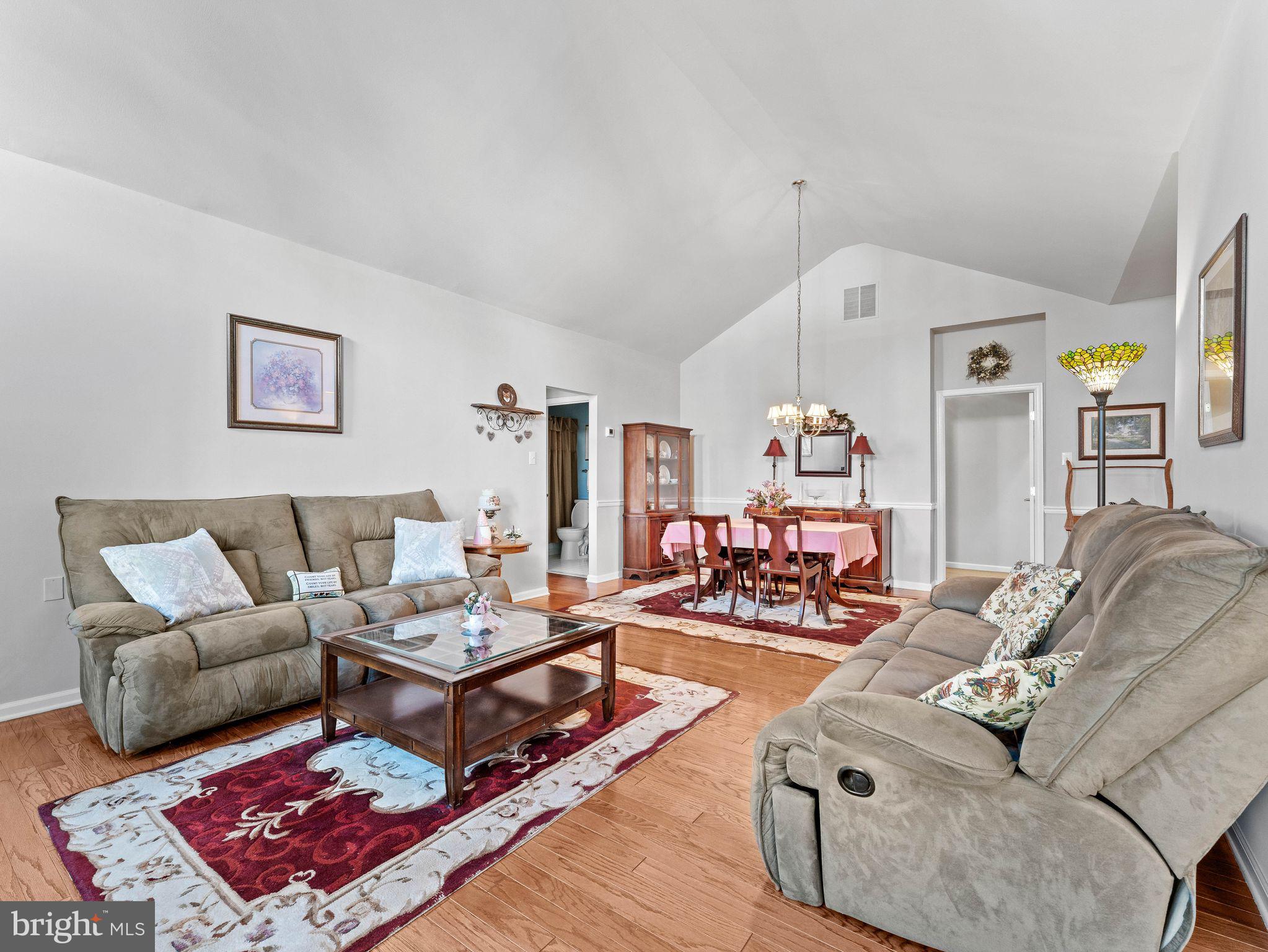1707 Hulnick Road, Unit 43830 Coatesville, PA 19320 - Photo 9 of 36 a living room with furniture and wooden floor
