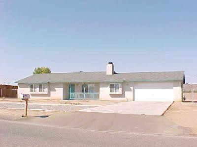 13112 El Rio Road Victorville, CA 92392 - Photo 1 of 1 a front view of a house with a garage