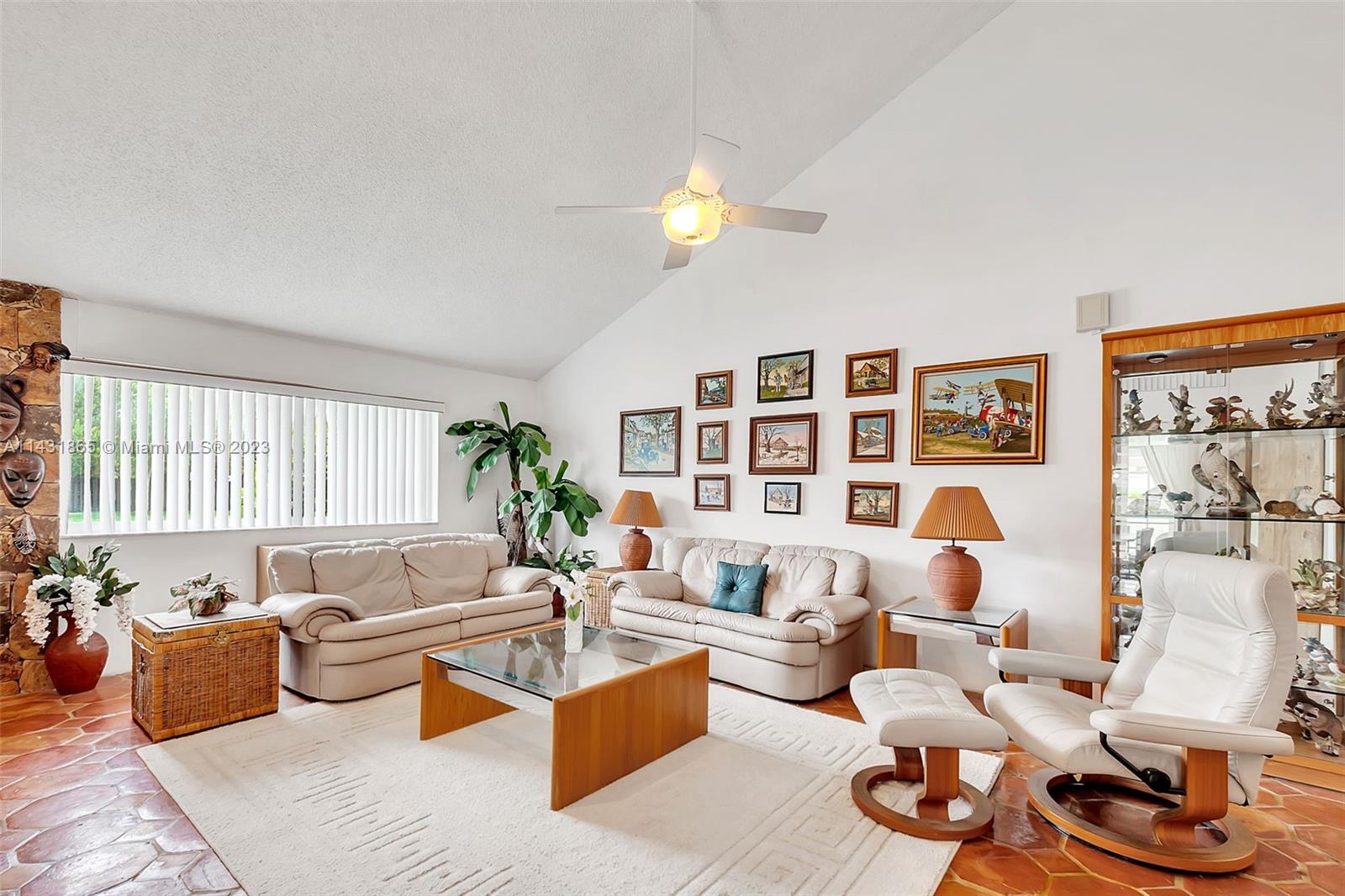 13120 Southwest 117th Street Miami, FL 33186 - Photo 11 of 29 a living room with furniture and a lamp