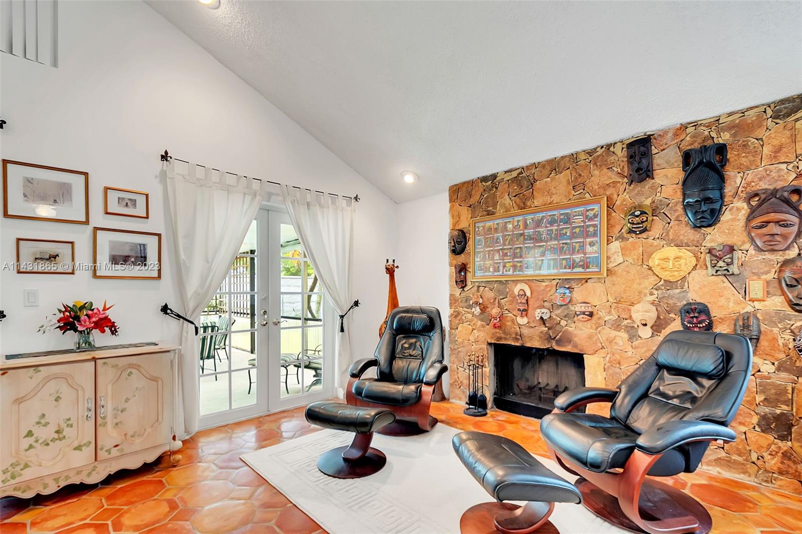 13120 Southwest 117th Street Miami, FL 33186 - Photo 12 of 29 a living room with furniture a fireplace and a flat screen tv