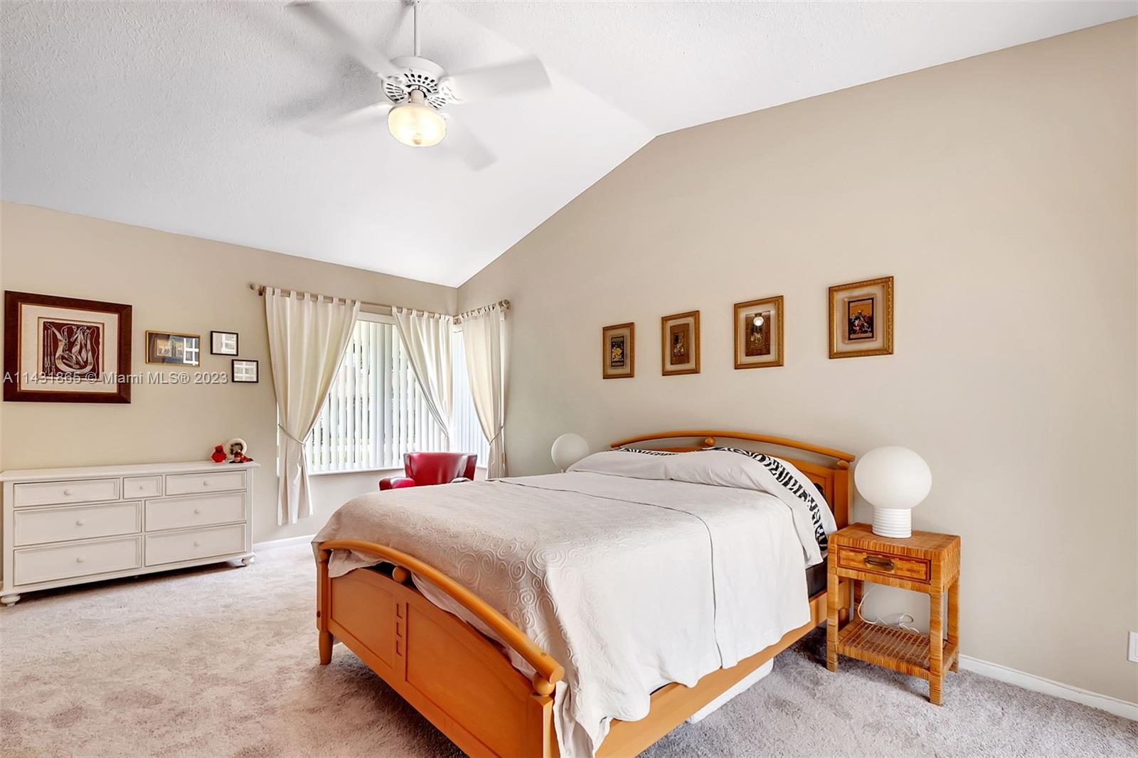 13120 Southwest 117th Street Miami, FL 33186 - Photo 16 of 29 a bed room with a bed and a chandelier