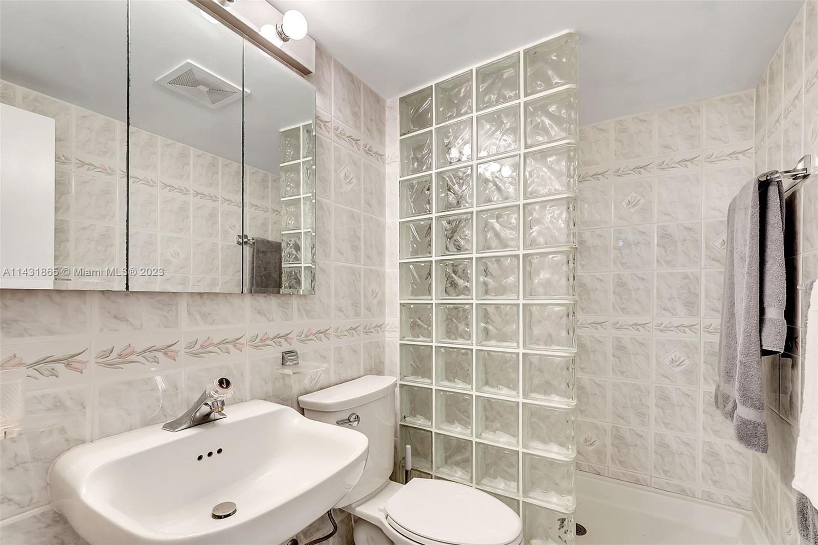 13120 Southwest 117th Street Miami, FL 33186 - Photo 17 of 29 a bathroom with a sink toilet and shower
