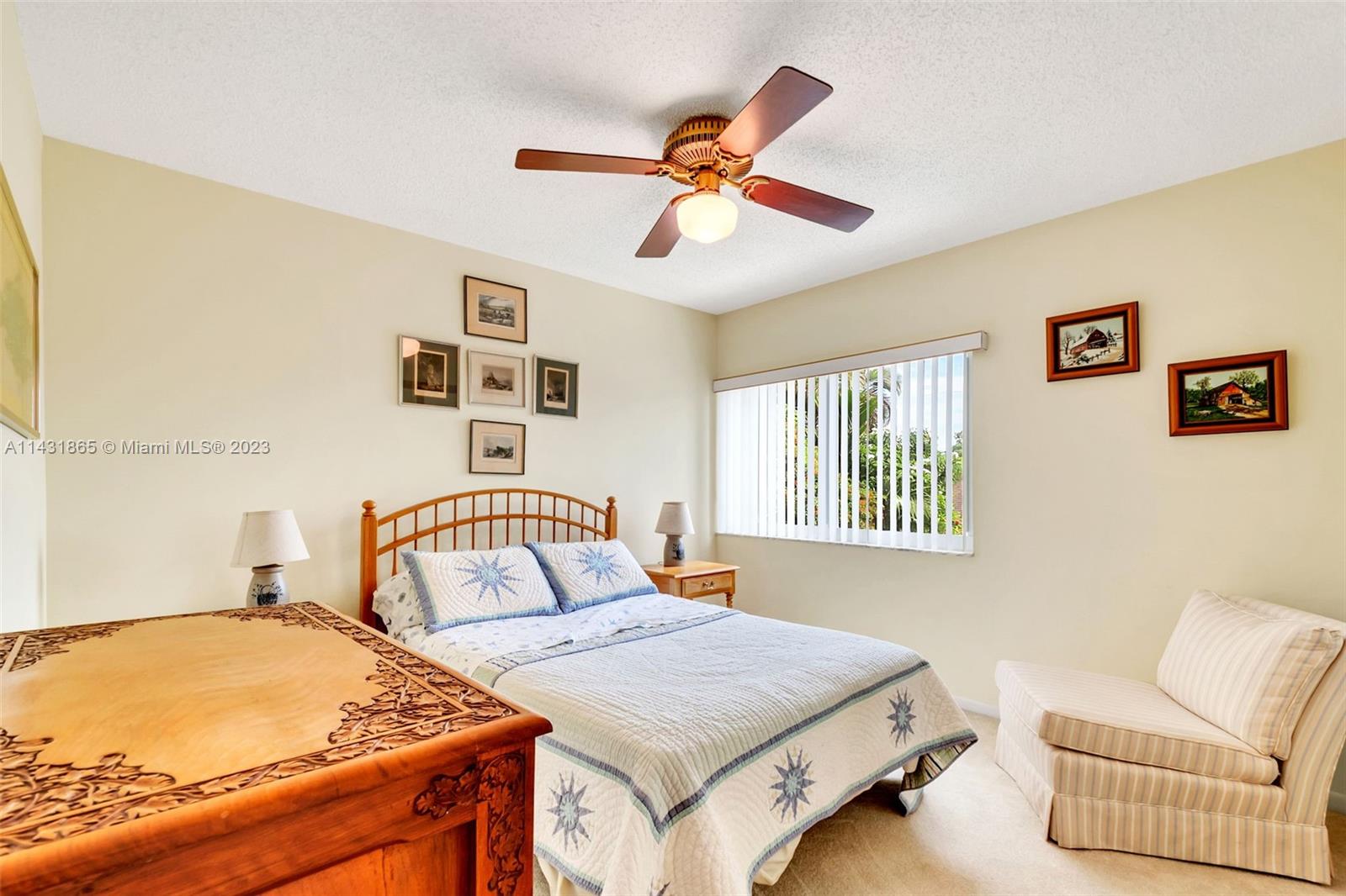 13120 Southwest 117th Street Miami, FL 33186 - Photo 18 of 29 a bedroom with a bed and window