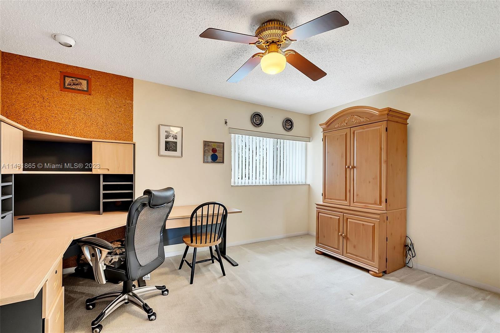 13120 Southwest 117th Street Miami, FL 33186 - Photo 19 of 29 a view of a livingroom with furniture and a ceiling fan