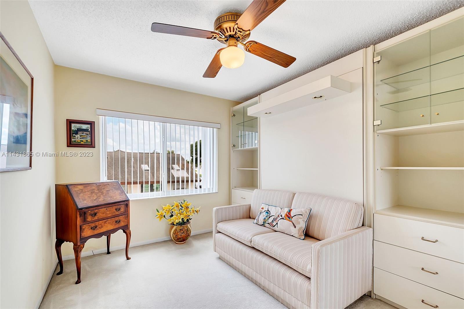 13120 Southwest 117th Street Miami, FL 33186 - Photo 20 of 29 a living room with furniture and a window
