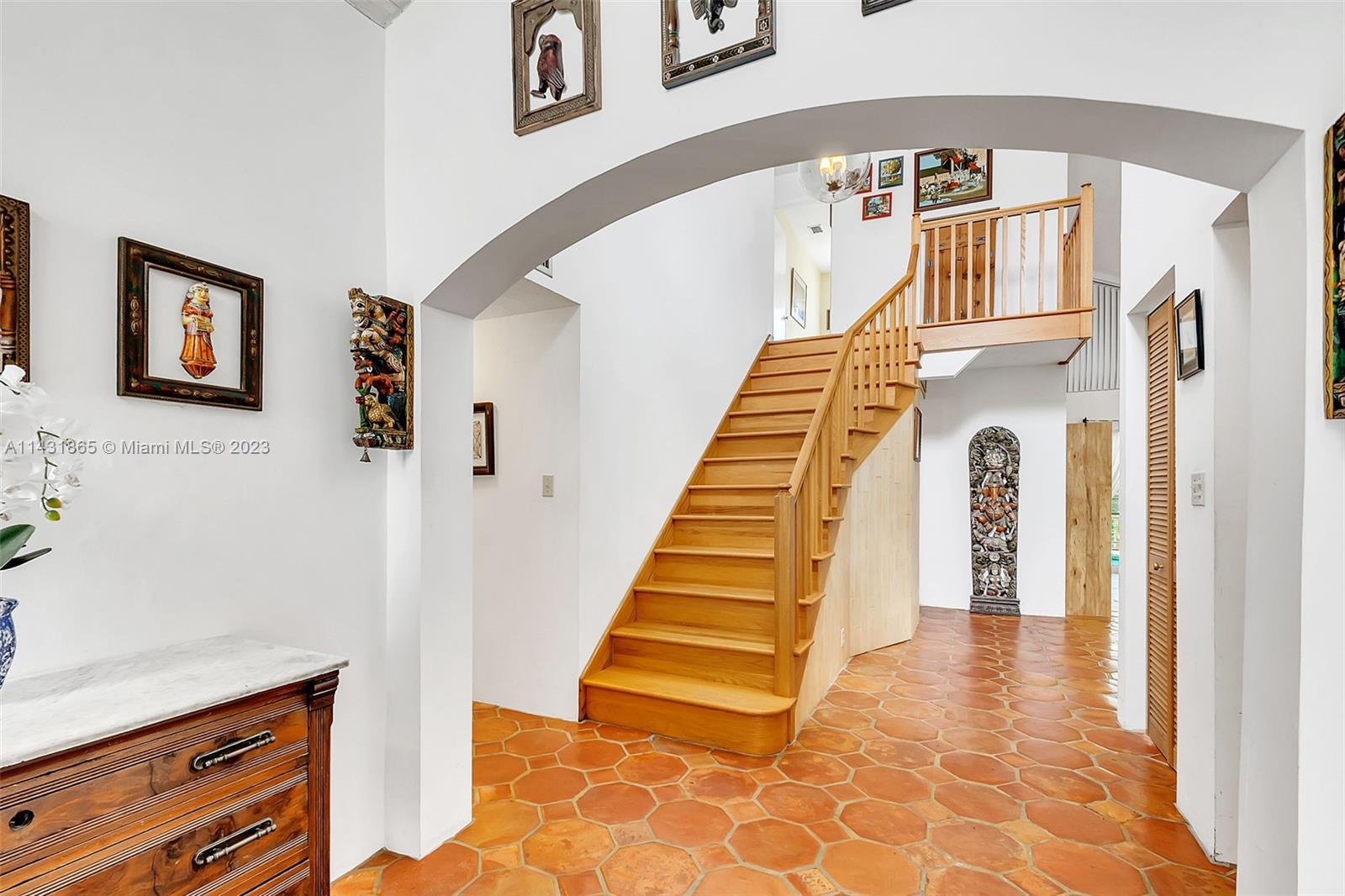 13120 Southwest 117th Street Miami, FL 33186 - Photo 2 of 29 a view of entryway and hall with wooden floor