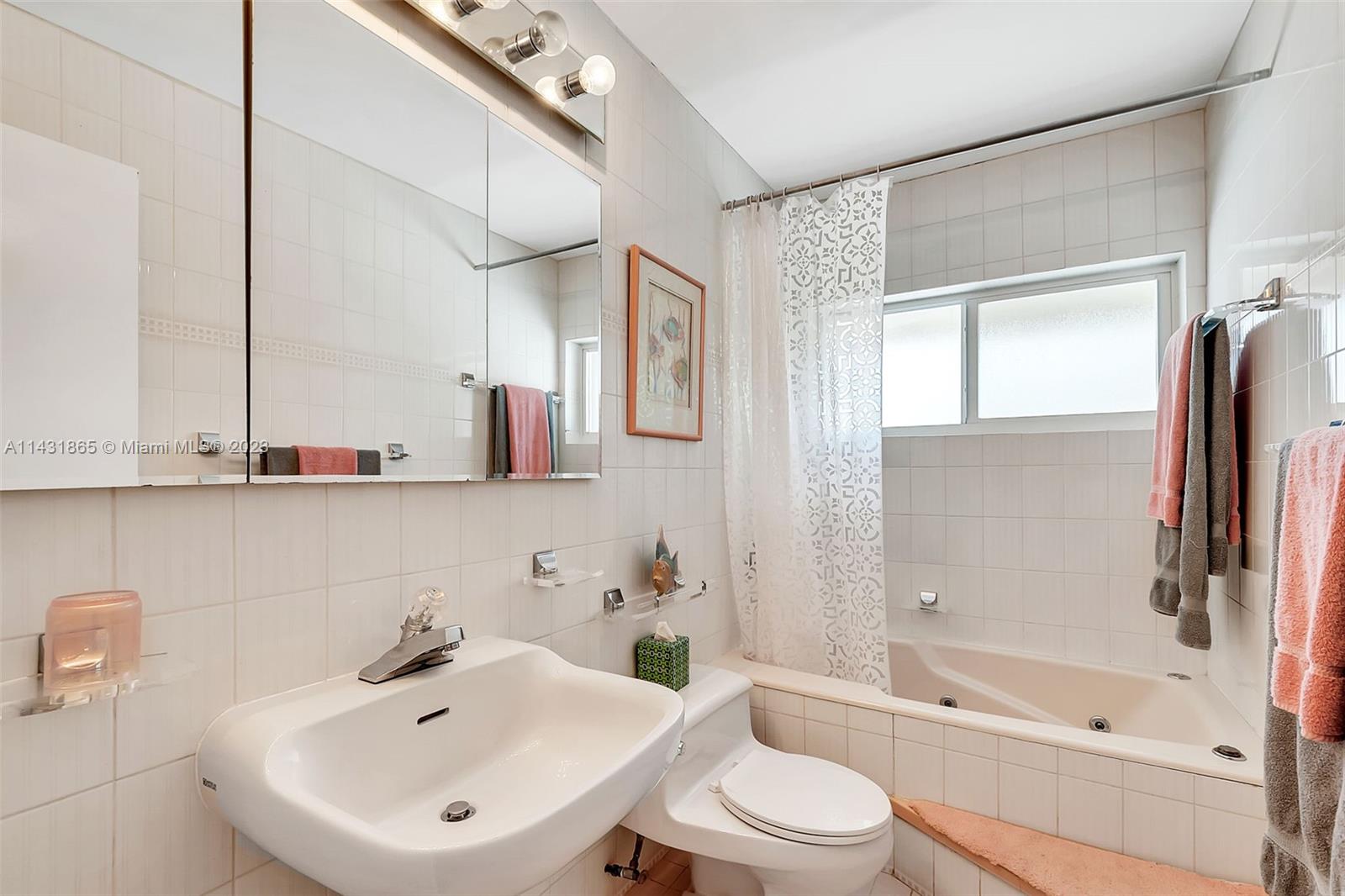 13120 Southwest 117th Street Miami, FL 33186 - Photo 21 of 29 a bathroom with a sink toilet and shower