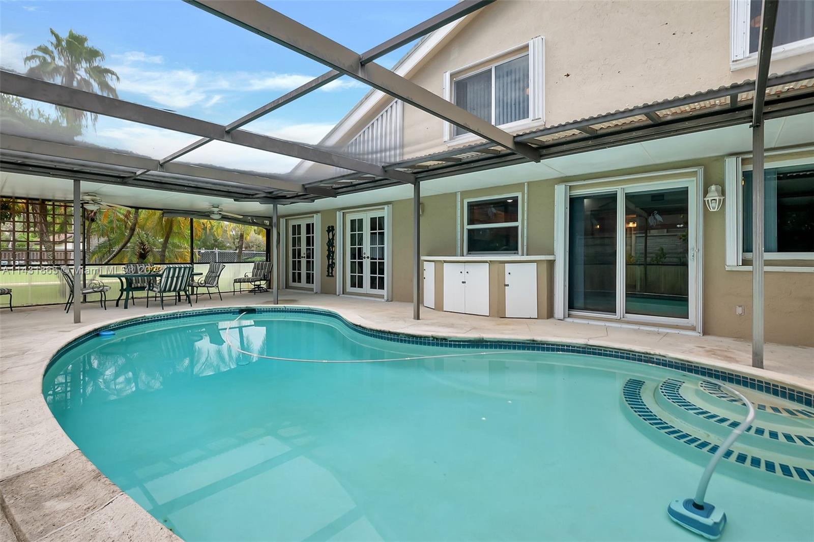 13120 Southwest 117th Street Miami, FL 33186 - Photo 26 of 29 a view of a house with swimming pool